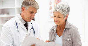 An image of a doctor showing a patient her results